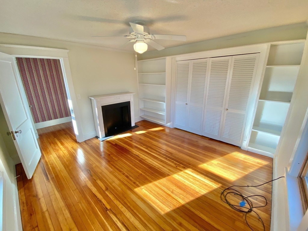 42 Amherst Road South Hadley, MA 01075 - Photo 21 of 28 a bedroom with a bed and a fireplace