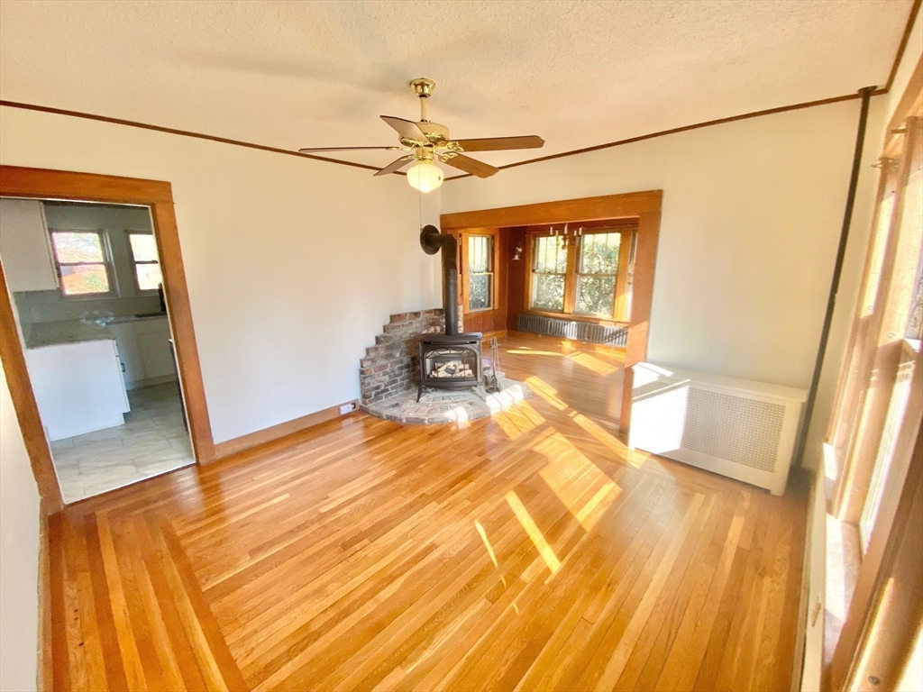 42 Amherst Road South Hadley, MA 01075 - Photo 23 of 28 a view of empty room with wooden floor and fan