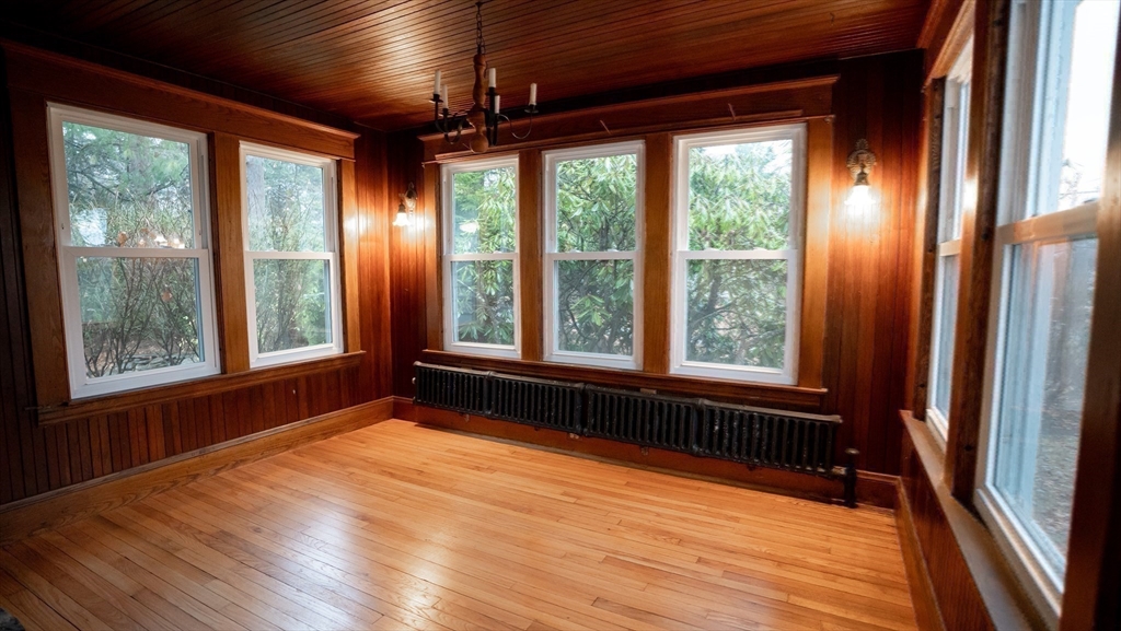 42 Amherst Road South Hadley, MA 01075 - Photo 24 of 28 a view of an empty room with wooden floor and a window