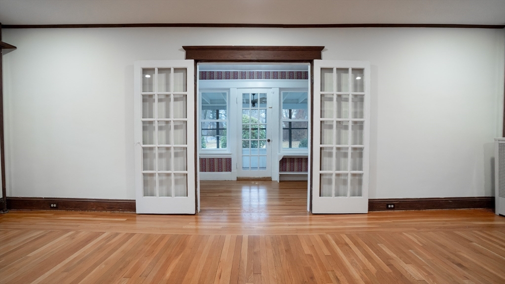 42 Amherst Road South Hadley, MA 01075 - Photo 10 of 28 a view of empty room with wooden floor and floor to ceiling window