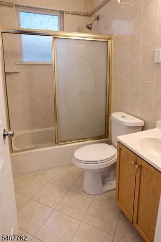 a bathroom with a toilet a sink and shower