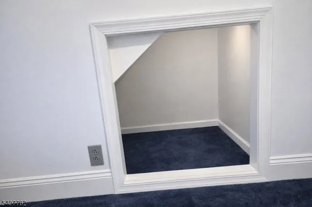 a view of walk in closet with wooden floor