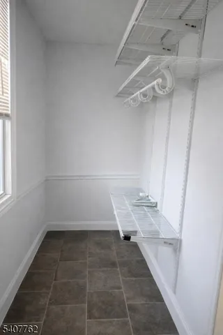 a view of a room with racks on the wall