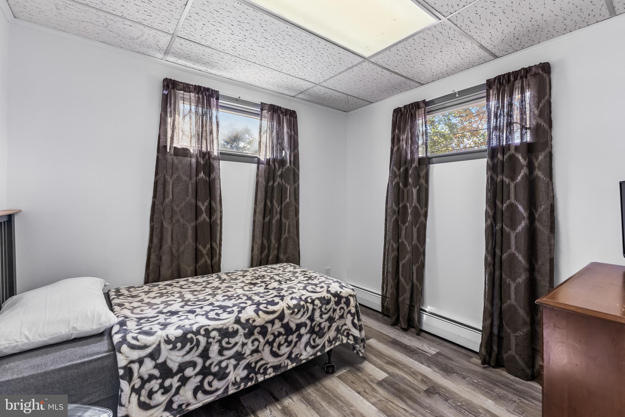 147 New Union Street Salem, NJ 08079 - Photo 22 of 28 a bedroom with a bed and a mirror