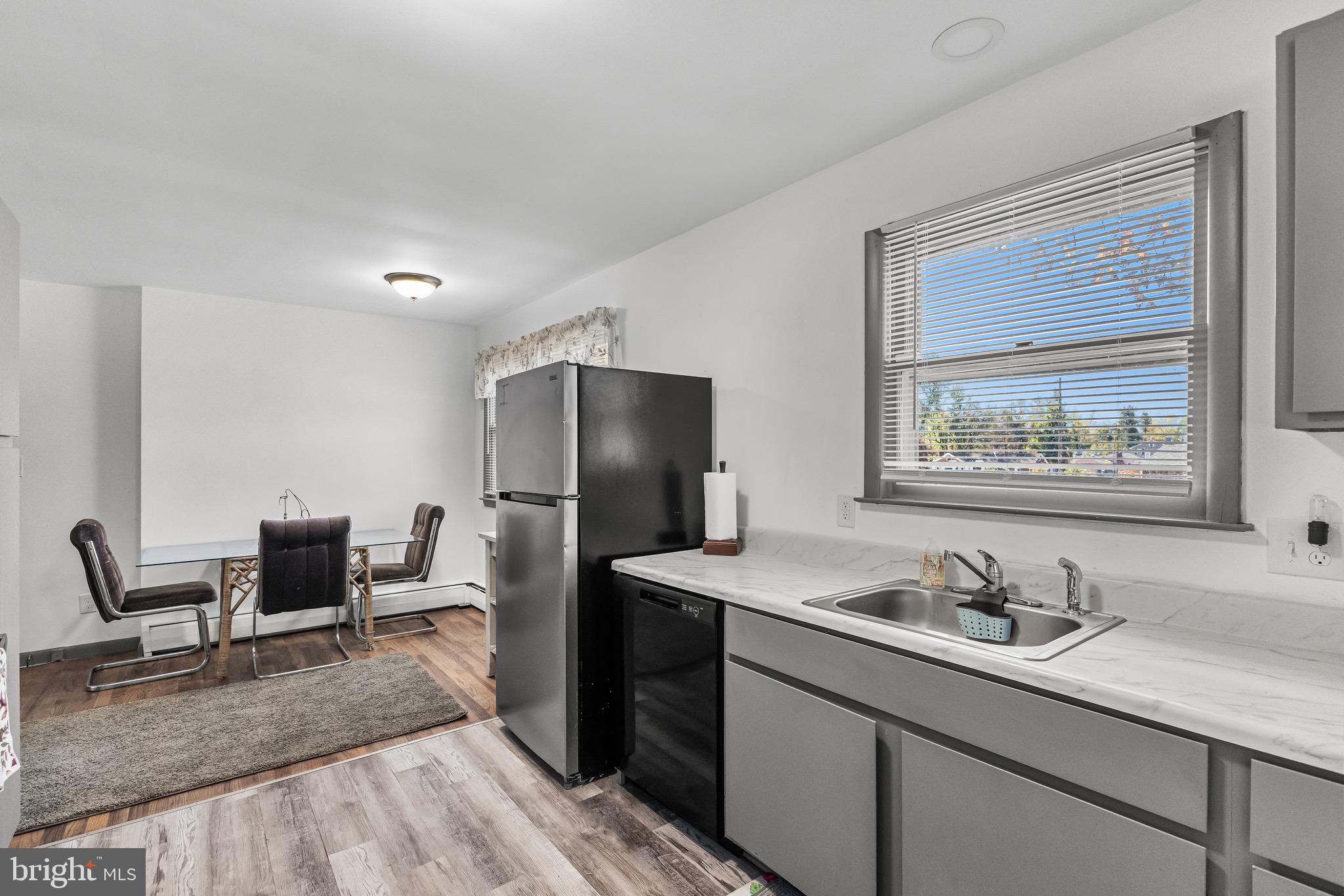 147 New Union Street Salem, NJ 08079 - Photo 4 of 28 a bathroom with a sink and a refrigerator