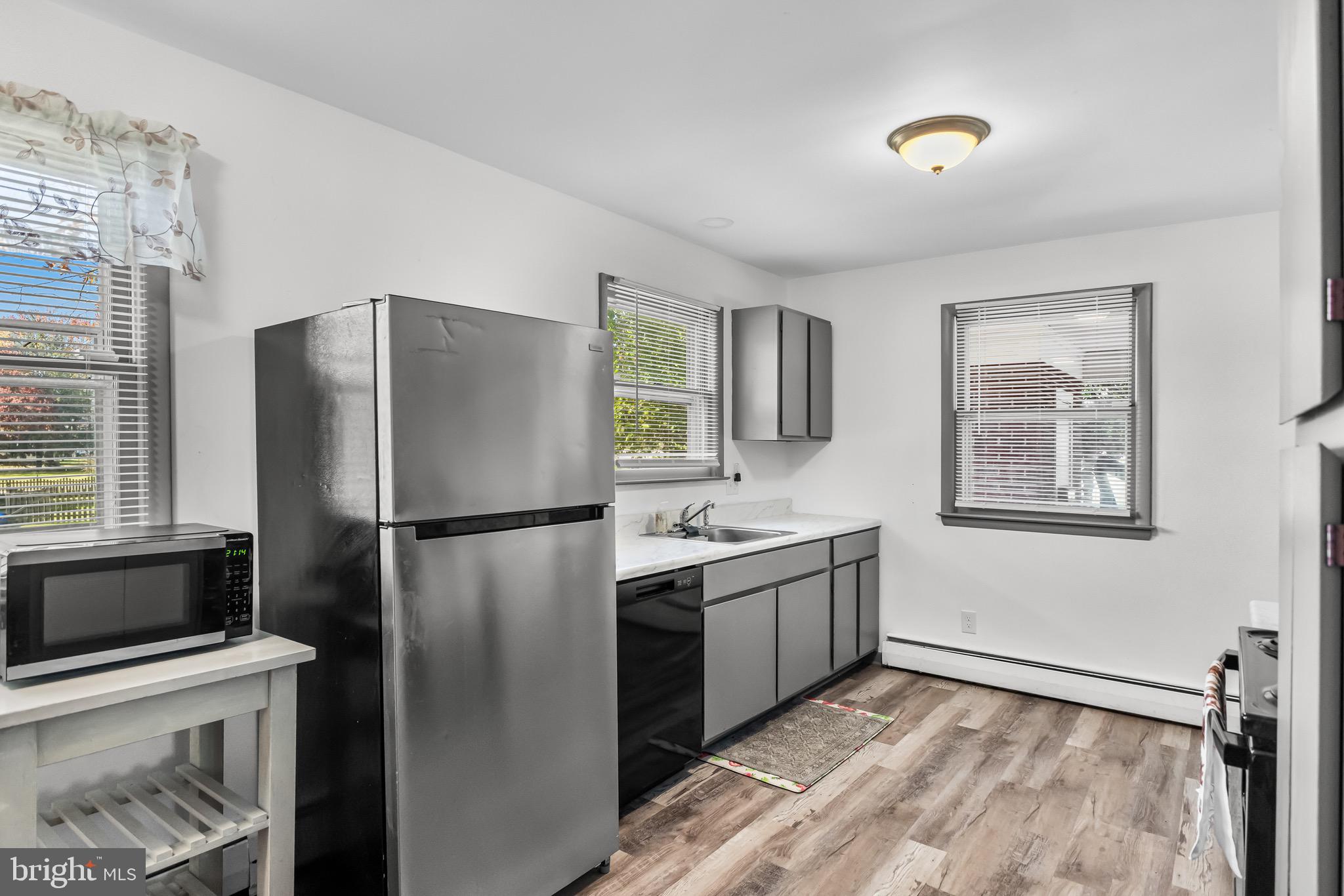 147 New Union Street Salem, NJ 08079 - Photo 5 of 28 a kitchen with stainless steel appliances a refrigerator sink and cabinets