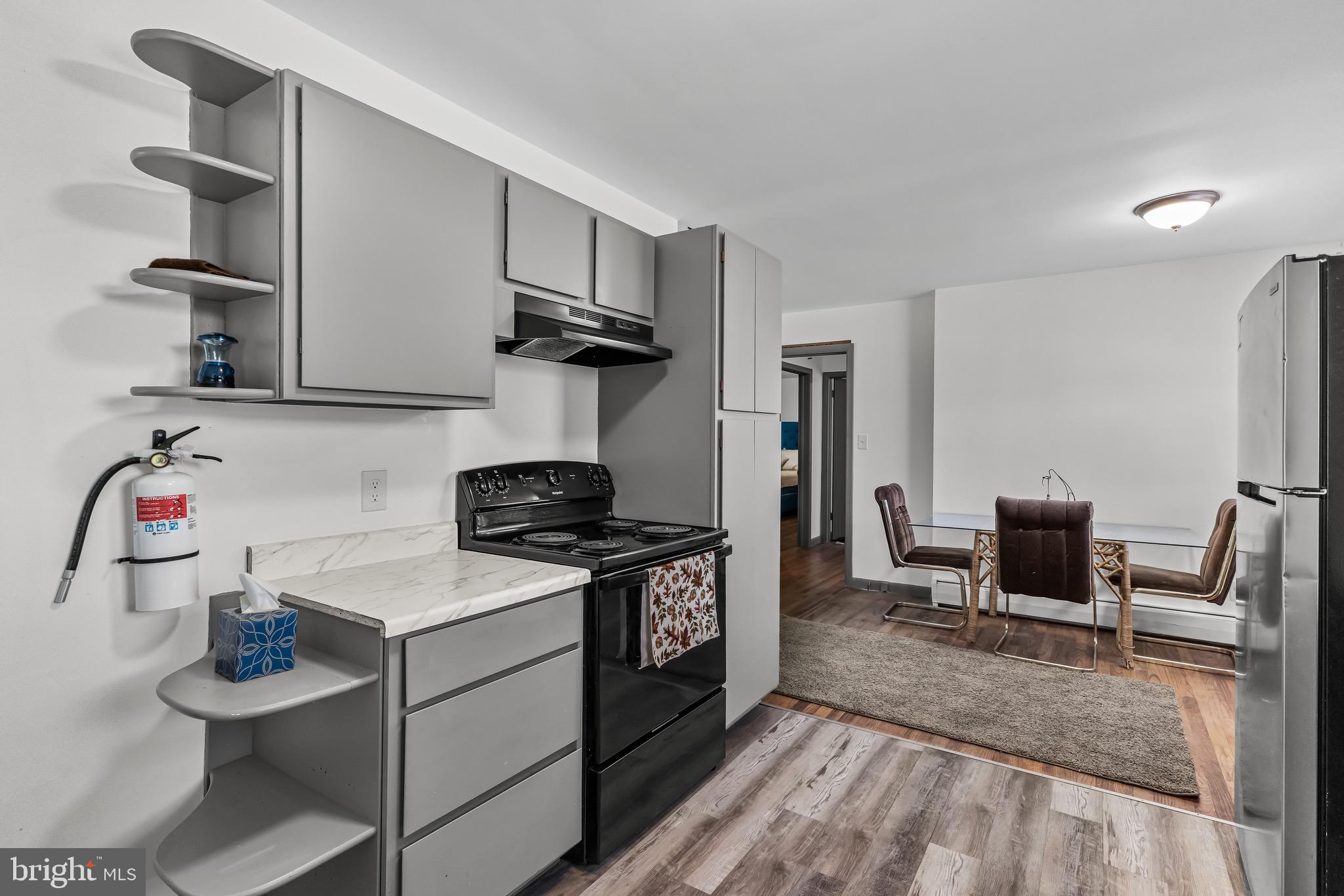 147 New Union Street Salem, NJ 08079 - Photo 6 of 28 a kitchen with stainless steel appliances granite countertop a stove and a sink