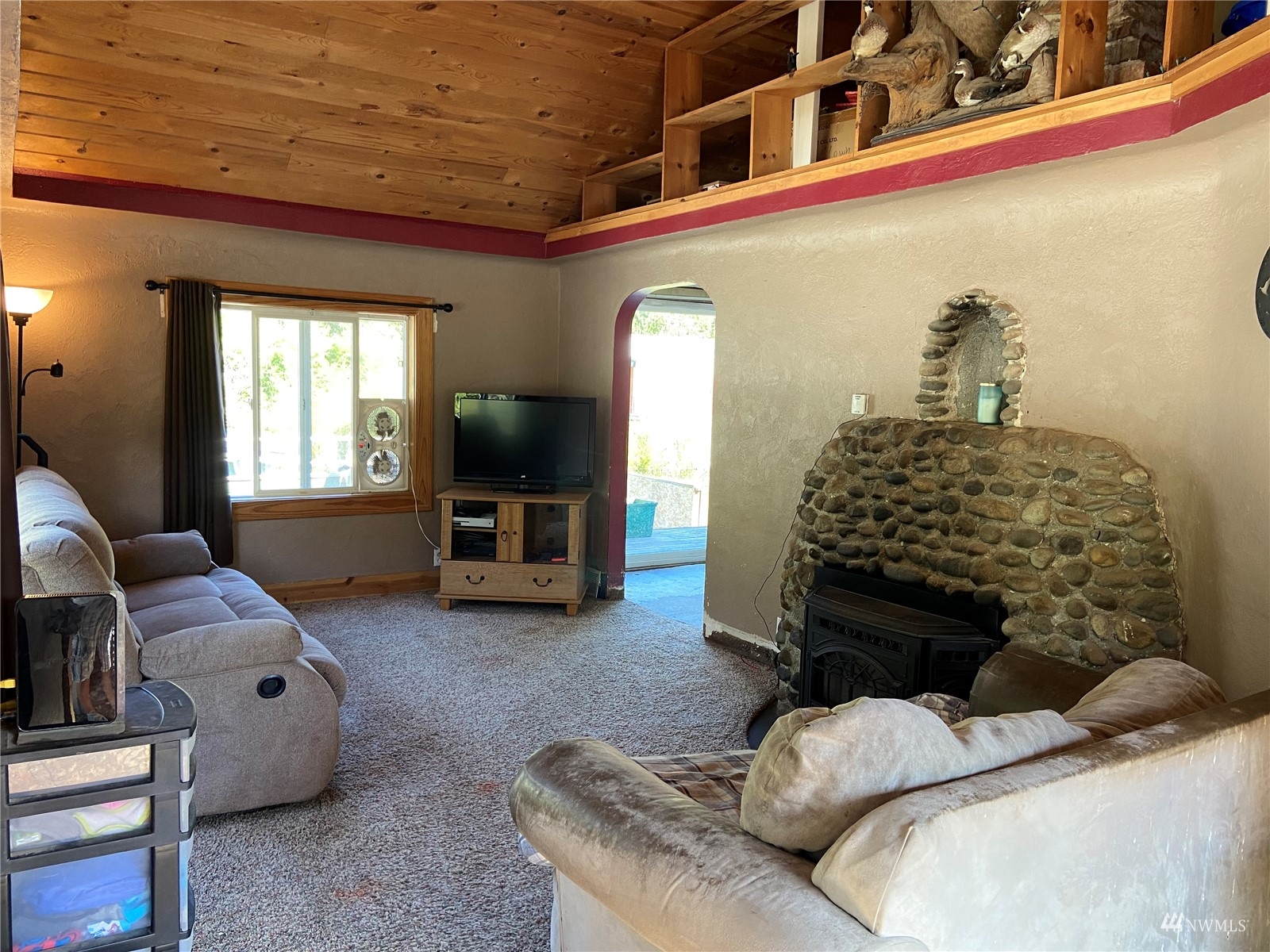 4191 Kitsap Lake Road Northwest Bremerton, WA 98312 - Photo 2 of 17 a living room with furniture and a fireplace