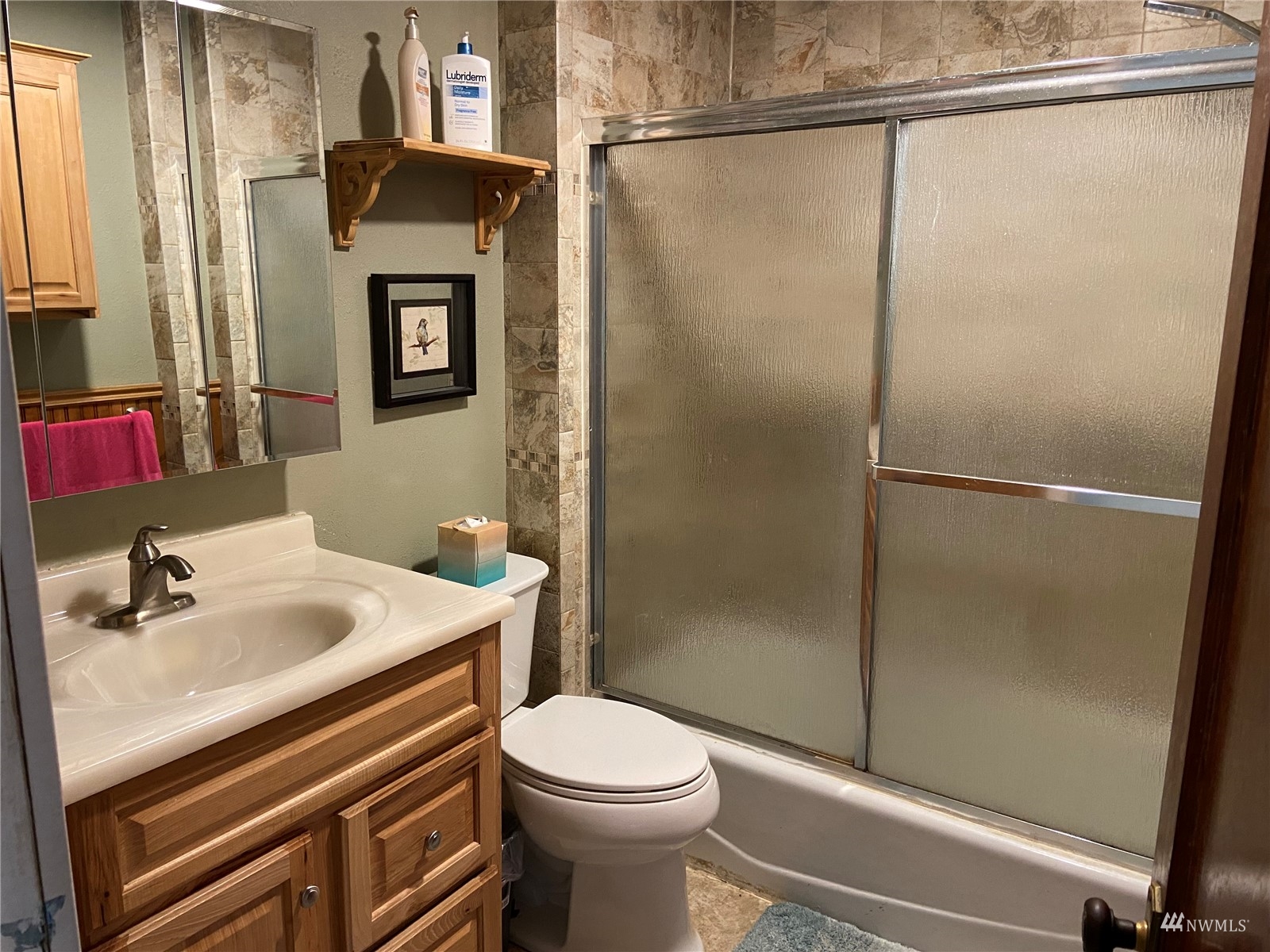 4191 Kitsap Lake Road Northwest Bremerton, WA 98312 - Photo 9 of 17 a bathroom with a sink toilet and shower