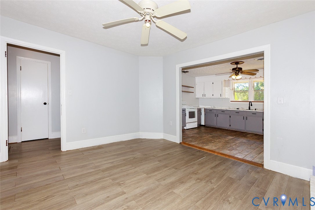 9903 Boze Road Ford, VA 23850 - Photo 16 of 45 wooden floor in an empty room with a window