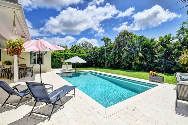a view of a swimming pool with a lounge chair