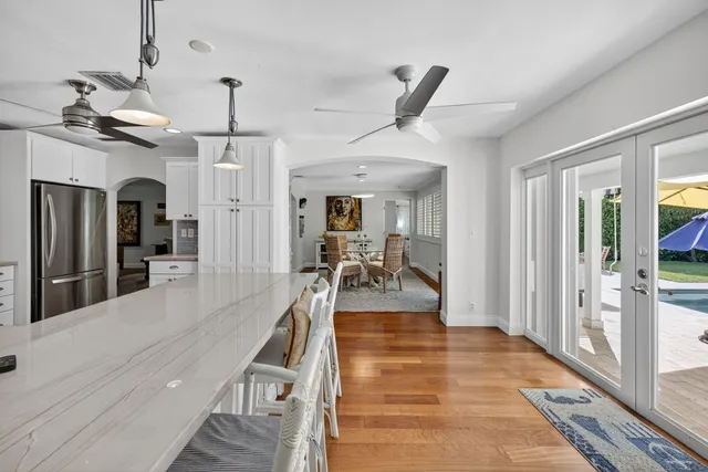 a spacious bedroom with a bed and a flat screen tv