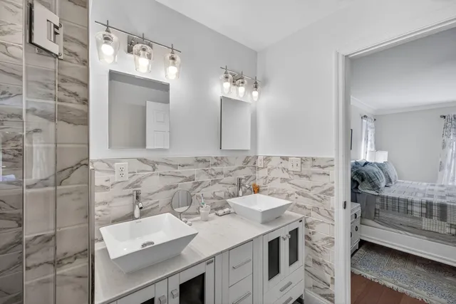 a bedroom with a bed and a couch