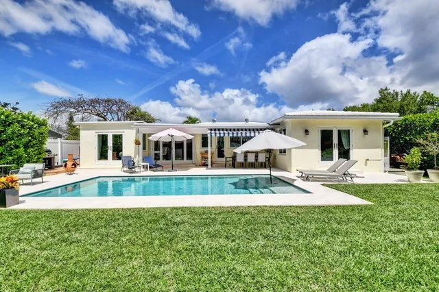 a view of a house with a flower garden