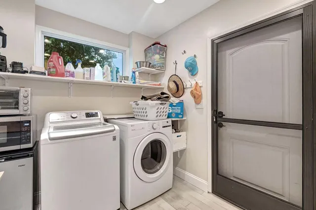 a view of a house with a backyard porch and sitting area