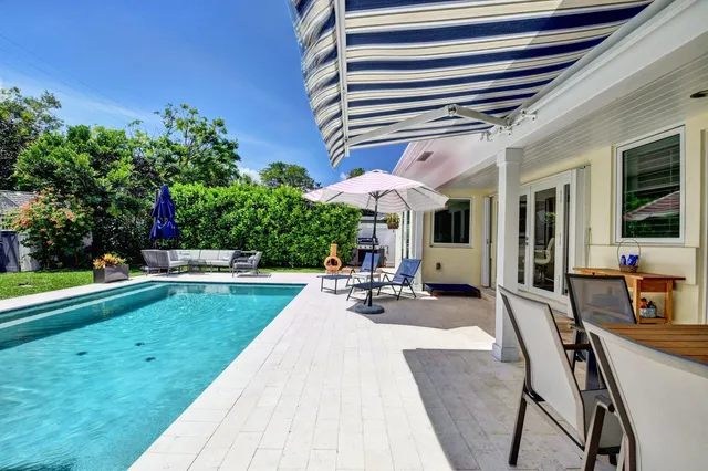 a view of swimming pool with chairs