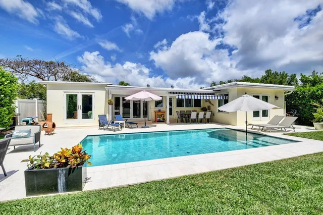 a view of a swimming pool with a patio