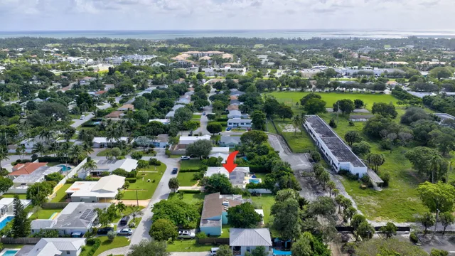 a view of a house with a backyard