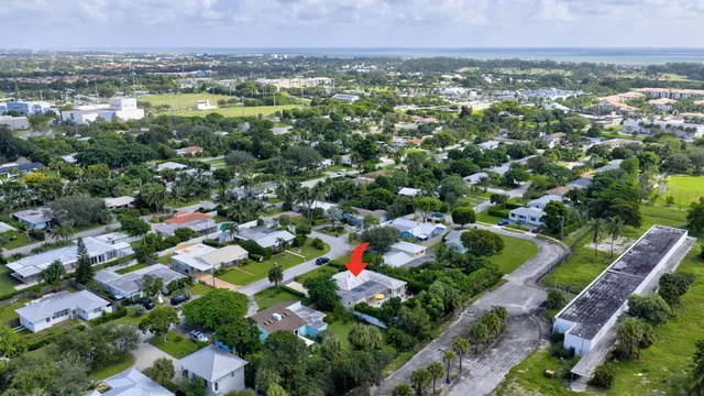 a front view of a house with yard and green space