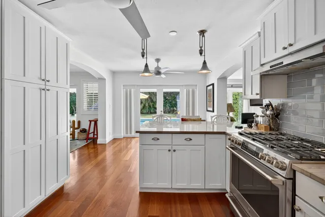 a living room with furniture and a book shelf