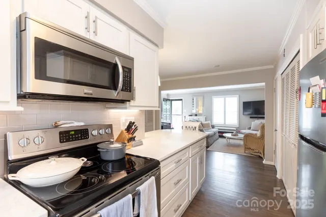 a kitchen with a stove and a microwave