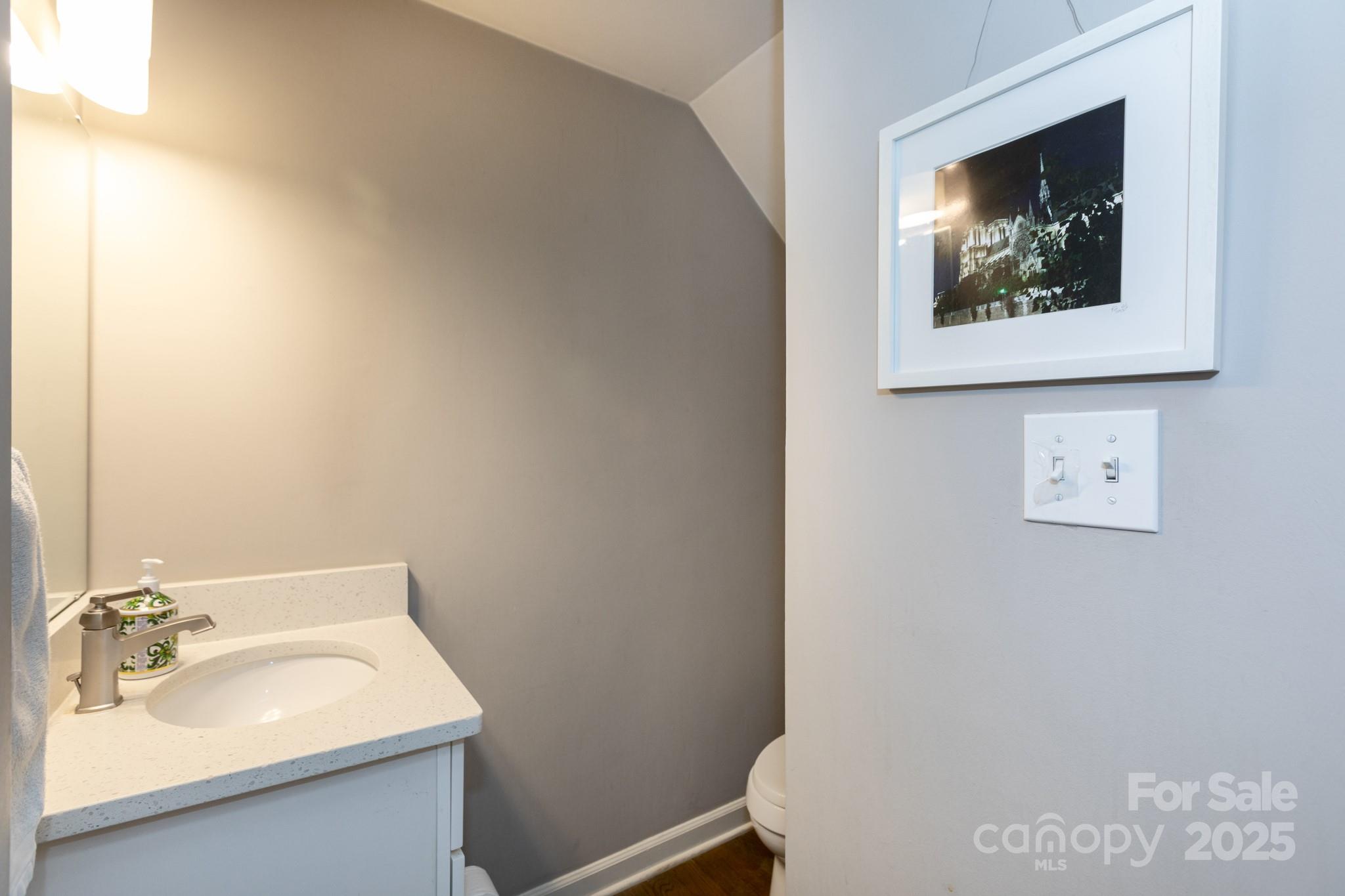 2229 Rexford Road, Unit E Charlotte, NC 28211 - Photo 19 of 28 a bathroom with a sink and a mirror