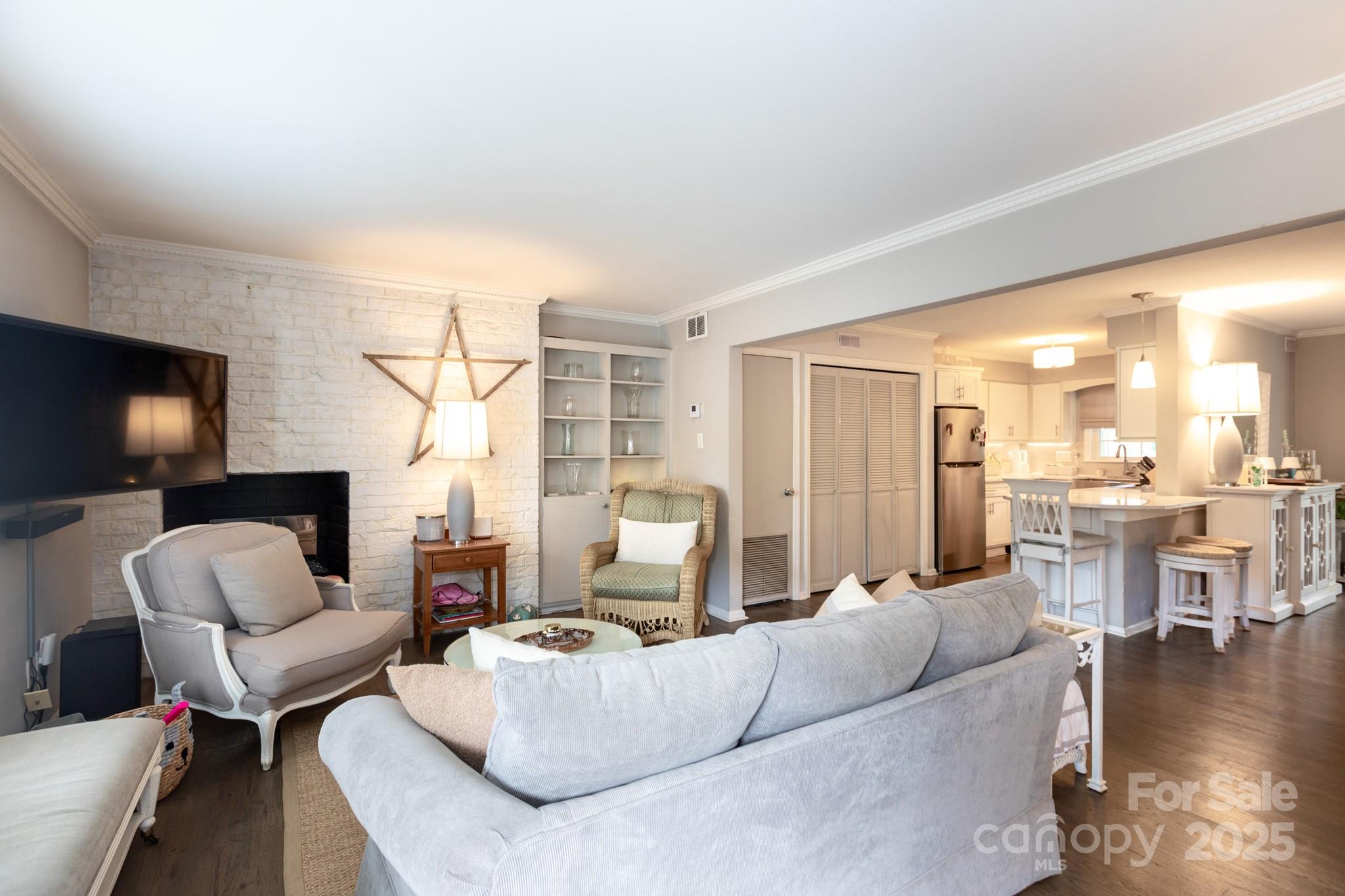 2229 Rexford Road, Unit E Charlotte, NC 28211 - Photo 2 of 28 a living room with furniture and a flat screen tv