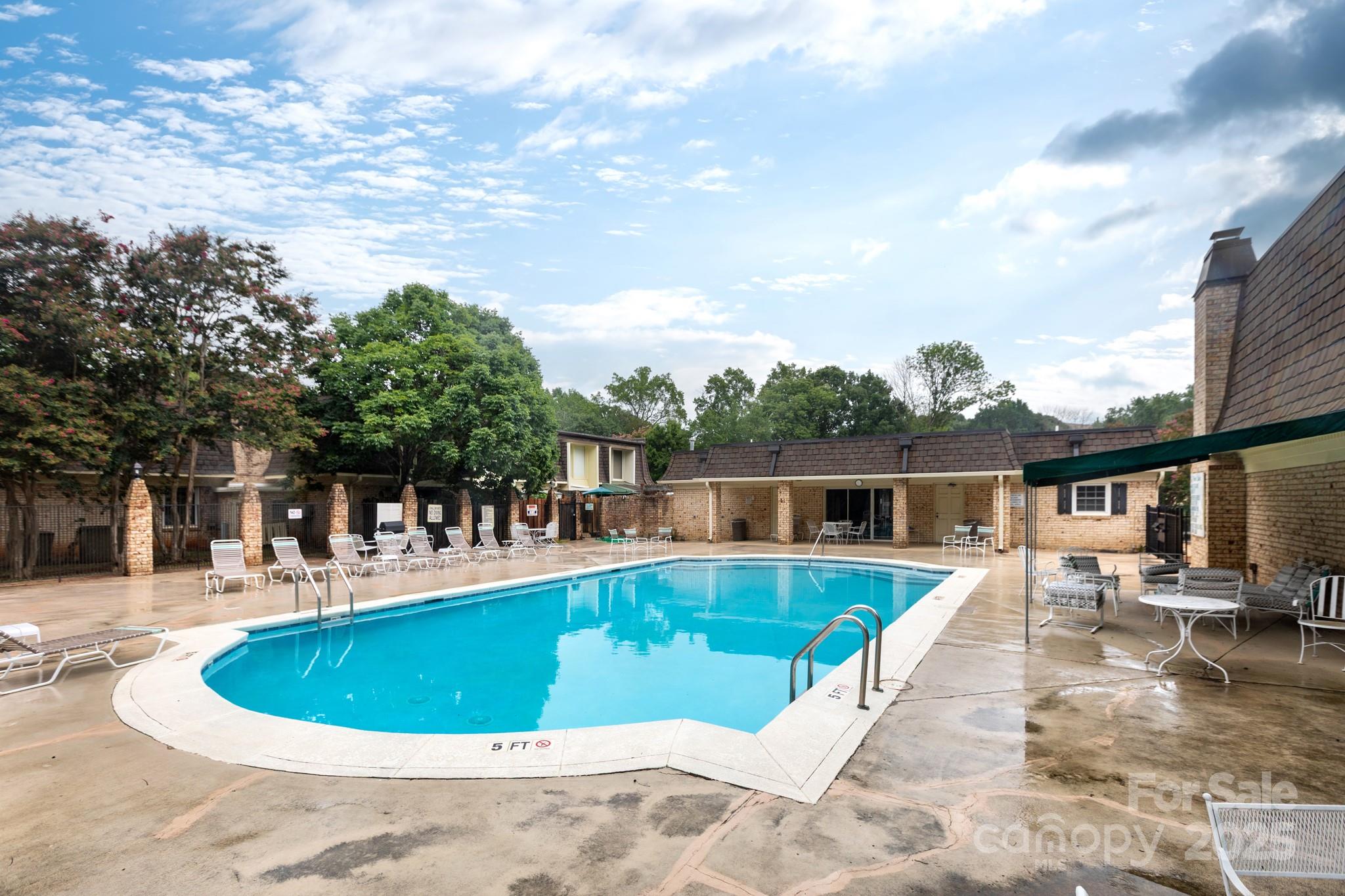 2229 Rexford Road, Unit E Charlotte, NC 28211 - Photo 27 of 28 a view of a house with swimming pool and sitting area