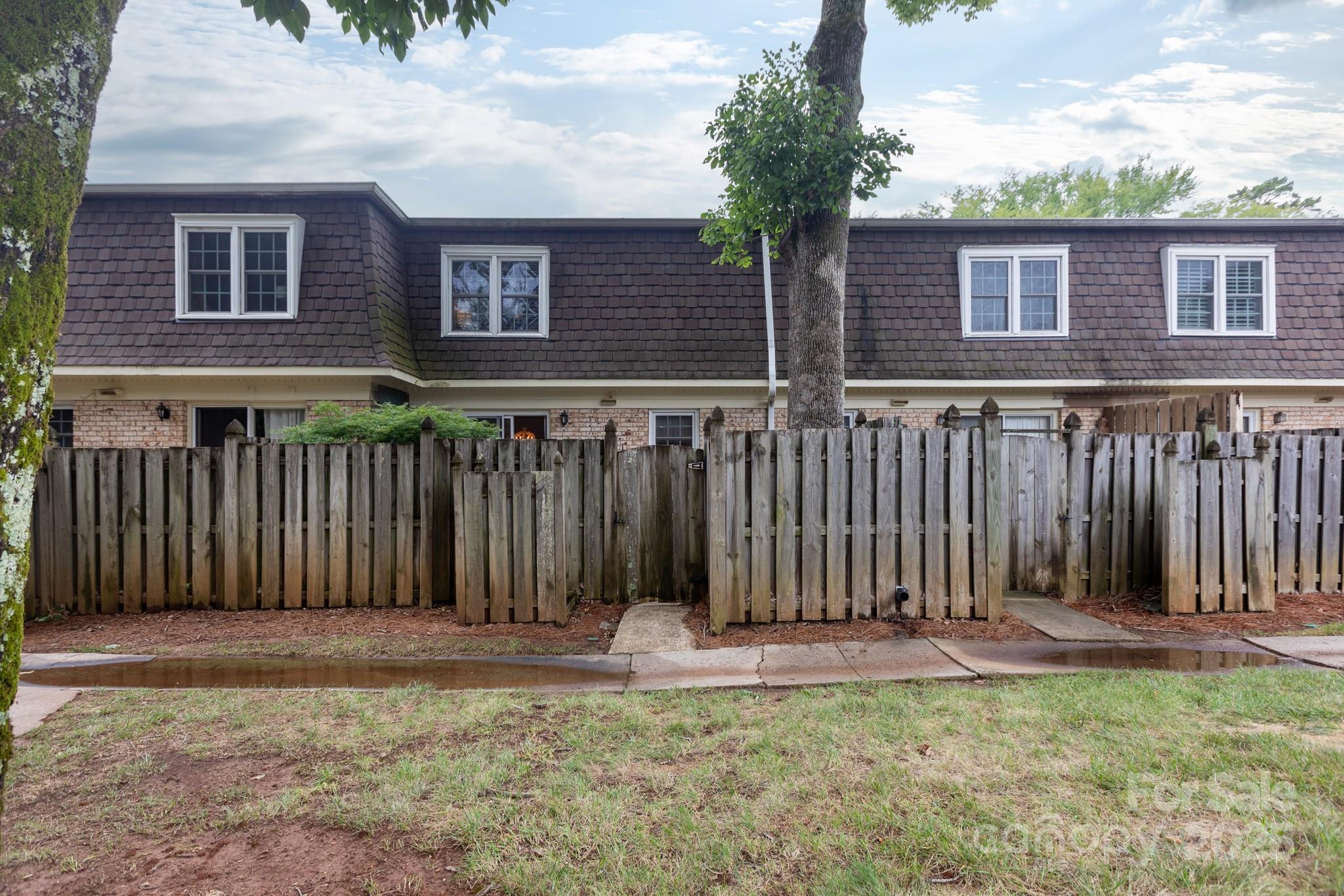 2229 Rexford Road, Unit E Charlotte, NC 28211 - Photo 28 of 28 a front view of a house with a fence