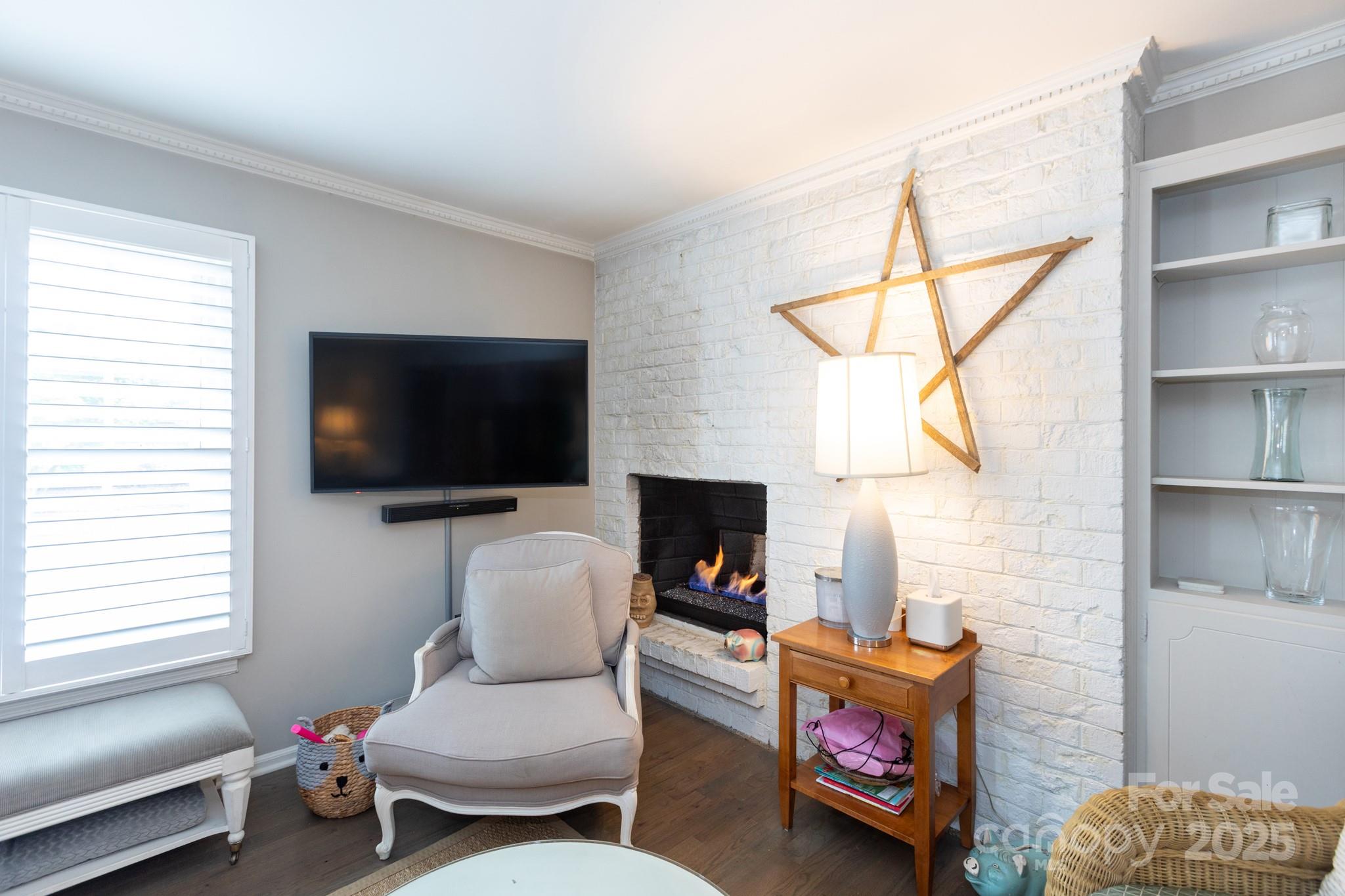 2229 Rexford Road, Unit E Charlotte, NC 28211 - Photo 7 of 28 a living room with furniture a flat screen tv and a window