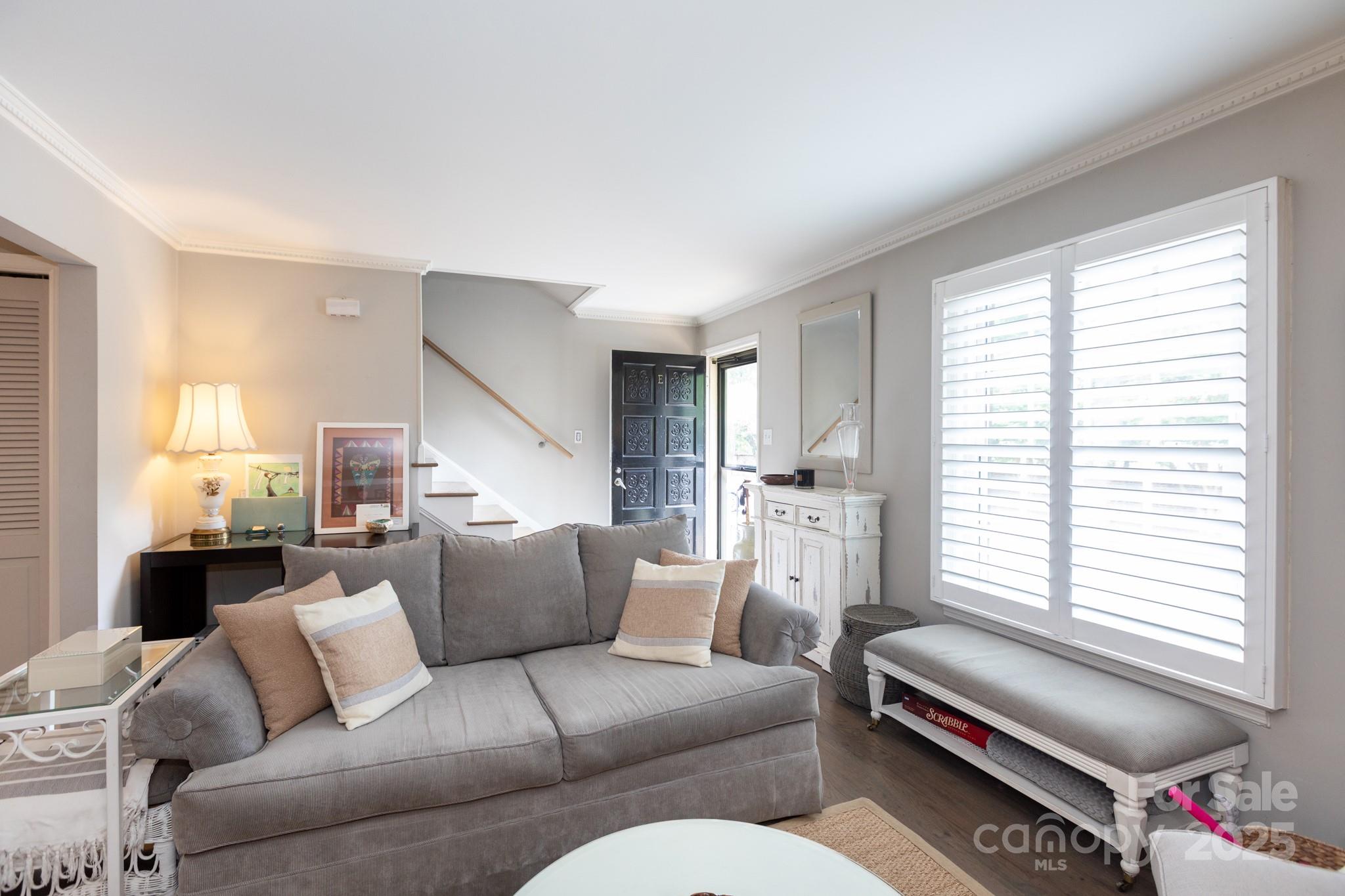 2229 Rexford Road, Unit E Charlotte, NC 28211 - Photo 8 of 28 a living room with furniture and a window