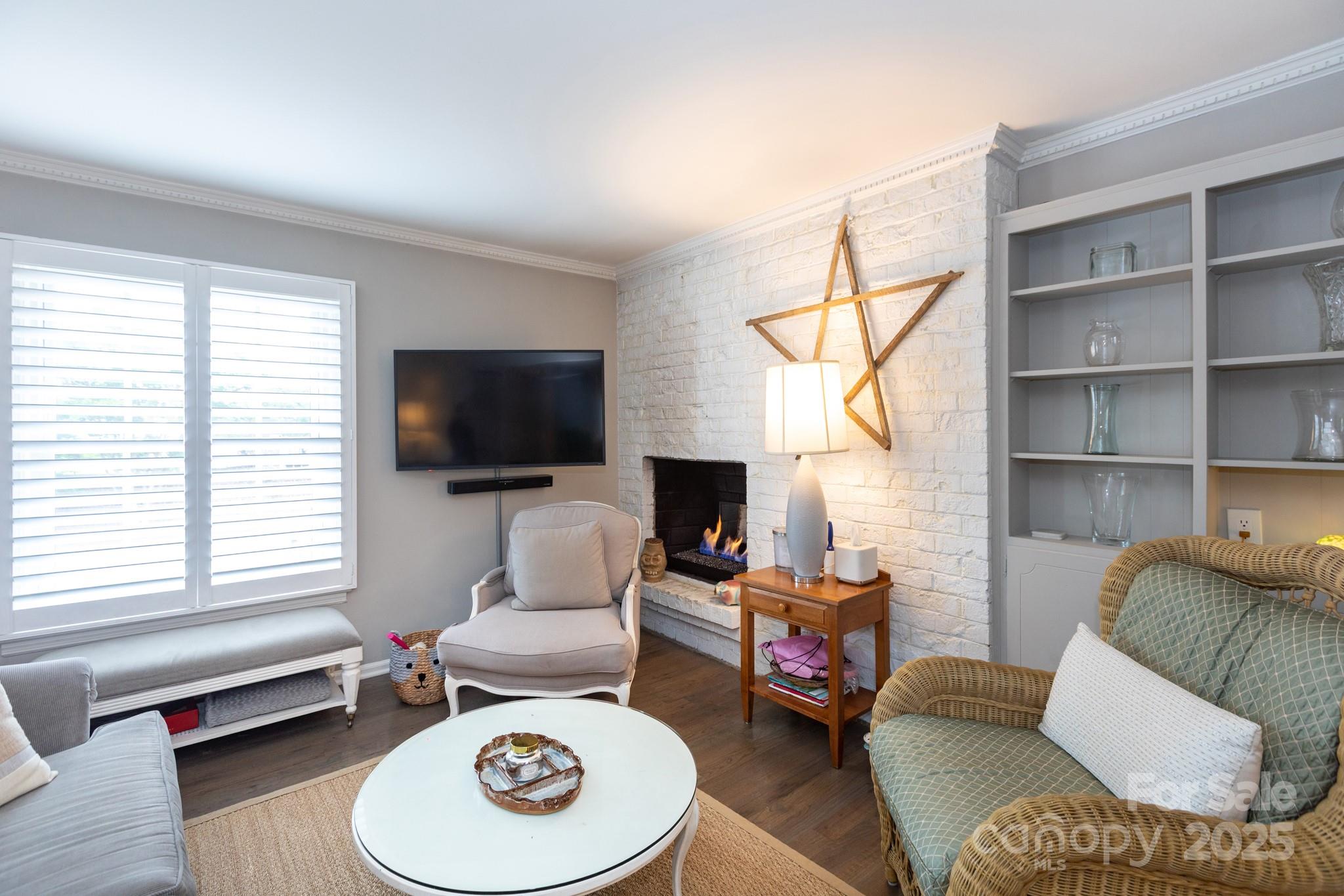 2229 Rexford Road, Unit E Charlotte, NC 28211 - Photo 9 of 28 a living room with furniture a window and a flat screen tv