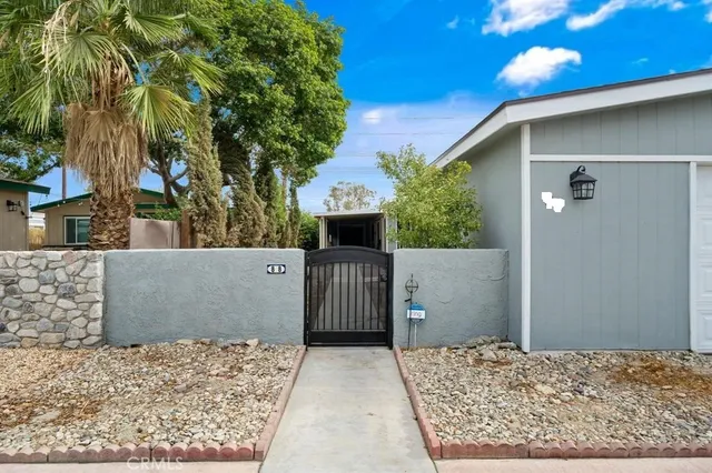 front view of a house with a fence