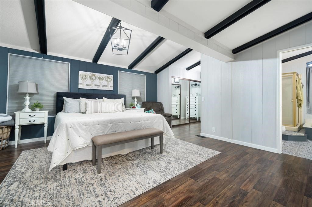 81641 Ave 48, Unit 88 Indio, CA 92201 - Photo 10 of 17 a bed sitting in a spacious bedroom next to a window