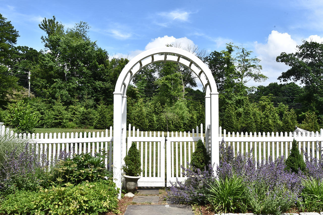 22 Country Club Road New Canaan, CT 06840 - Photo 2 of 47 a view of a garden from a balcony