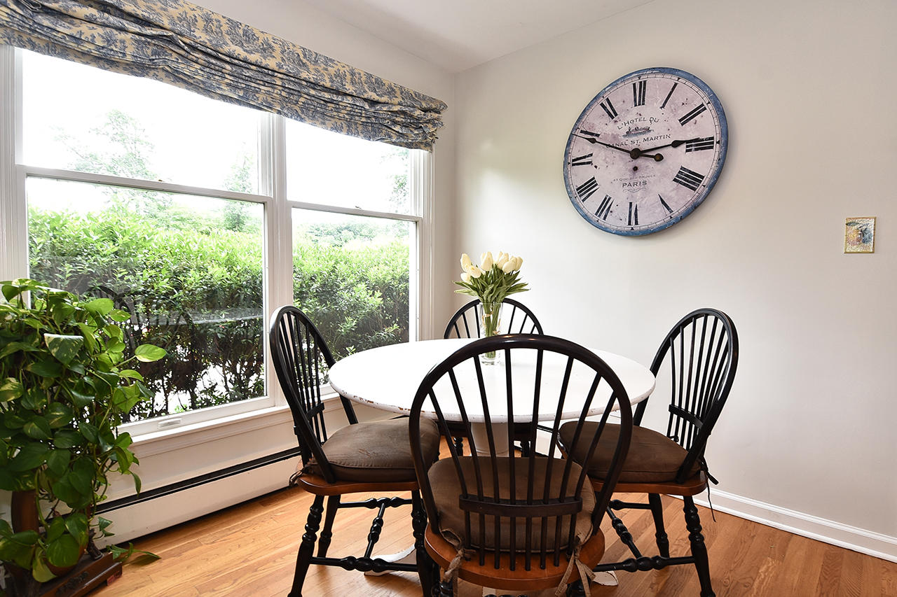 22 Country Club Road New Canaan, CT 06840 - Photo 12 of 47 a view of a dining room with furniture window and wooden floor