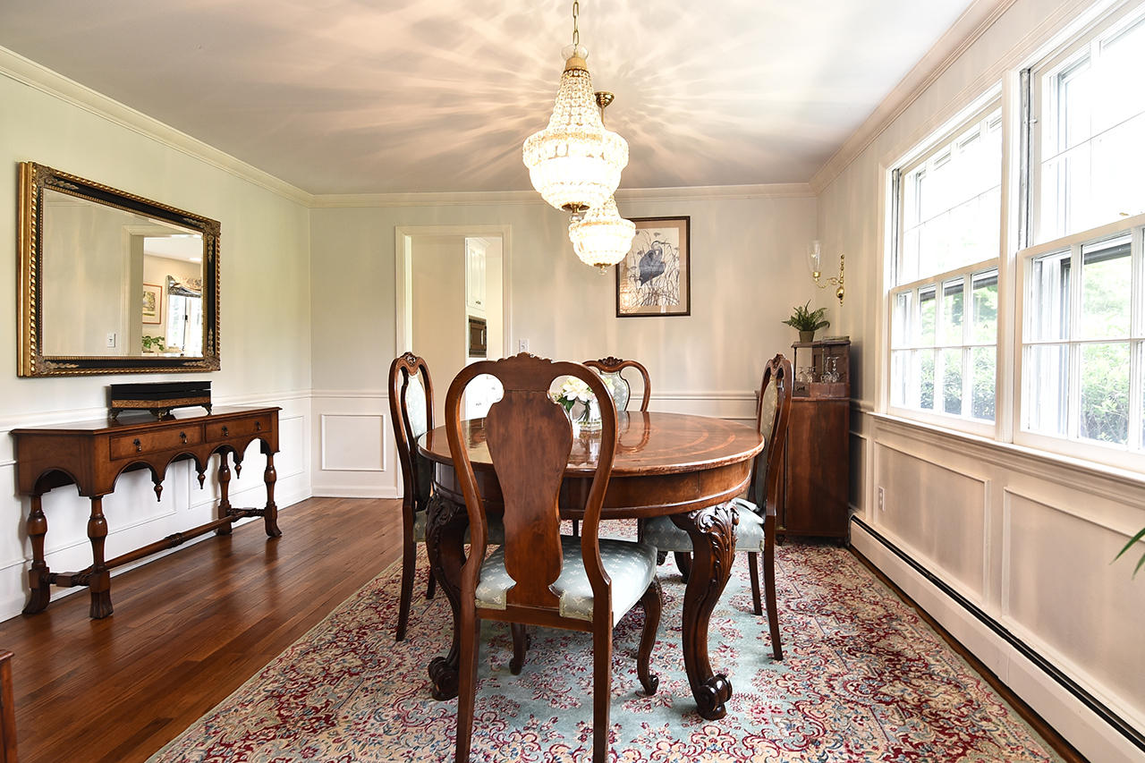22 Country Club Road New Canaan, CT 06840 - Photo 15 of 47 a view of a dining room with furniture window and wooden floor