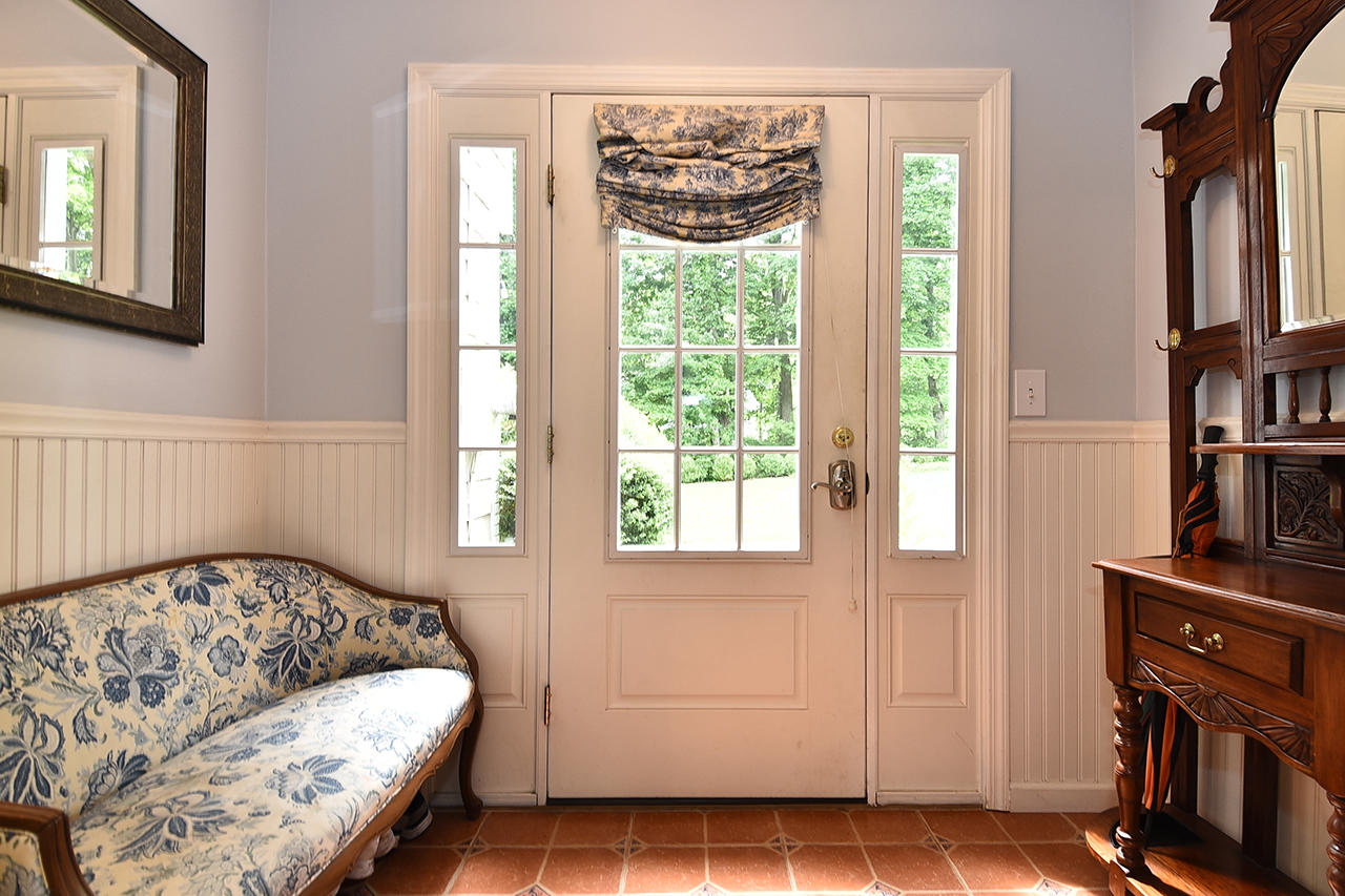 22 Country Club Road New Canaan, CT 06840 - Photo 18 of 47 a bedroom with a bed and a window