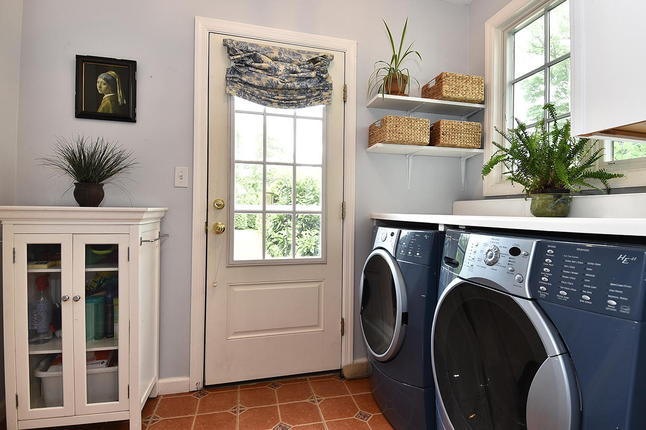22 Country Club Road New Canaan, CT 06840 - Photo 19 of 47 a view of entryway with washer and dryer