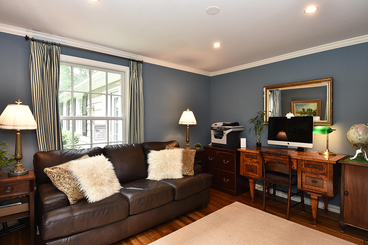 22 Country Club Road New Canaan, CT 06840 - Photo 21 of 47 a living room with furniture and a flat screen tv