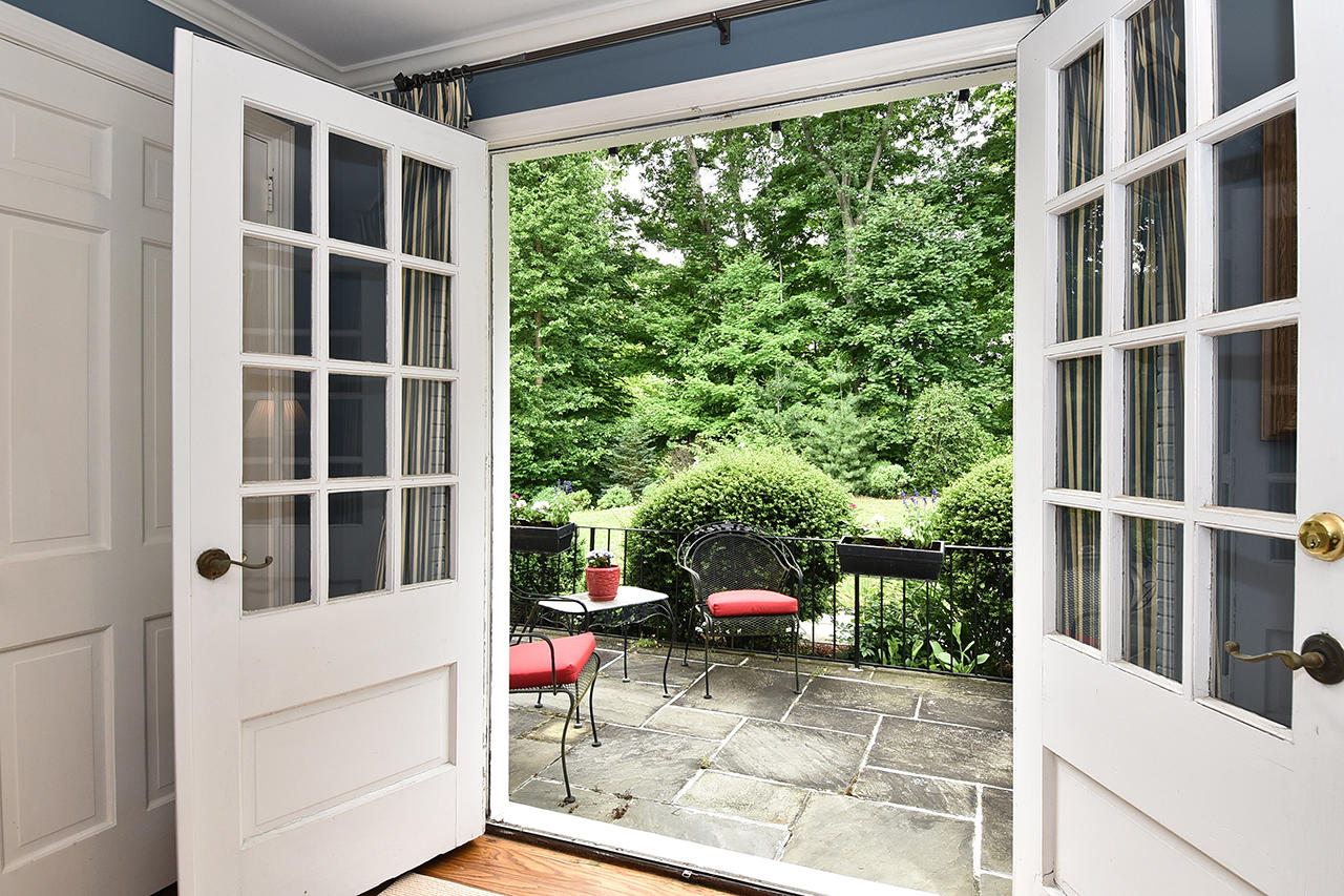 22 Country Club Road New Canaan, CT 06840 - Photo 22 of 47 a view of porch with a bench and potted plants