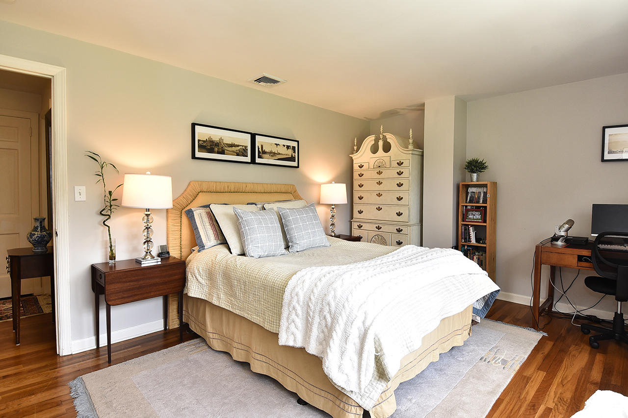 22 Country Club Road New Canaan, CT 06840 - Photo 29 of 47 a bedroom with a bed and a table in it