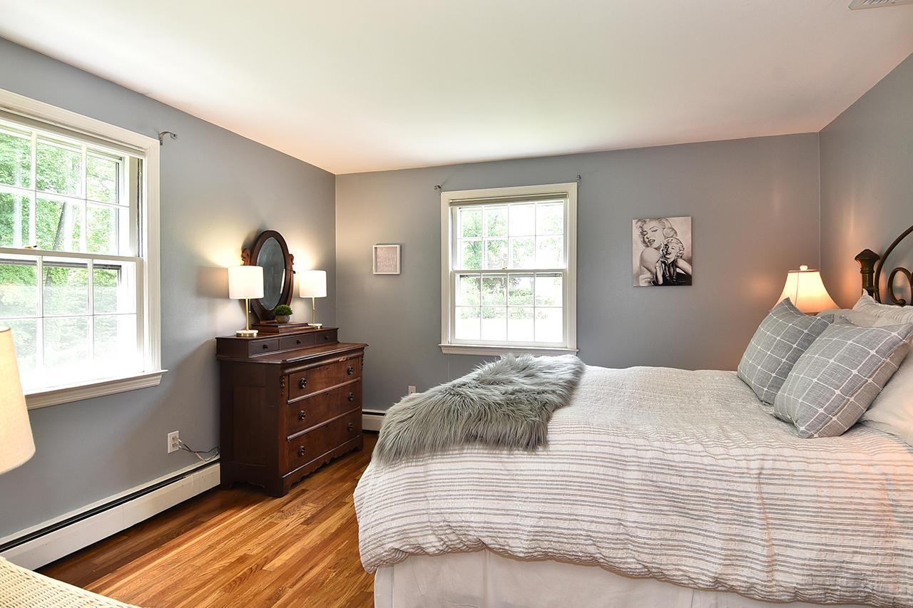 22 Country Club Road New Canaan, CT 06840 - Photo 30 of 47 a bedroom with a bed and a window