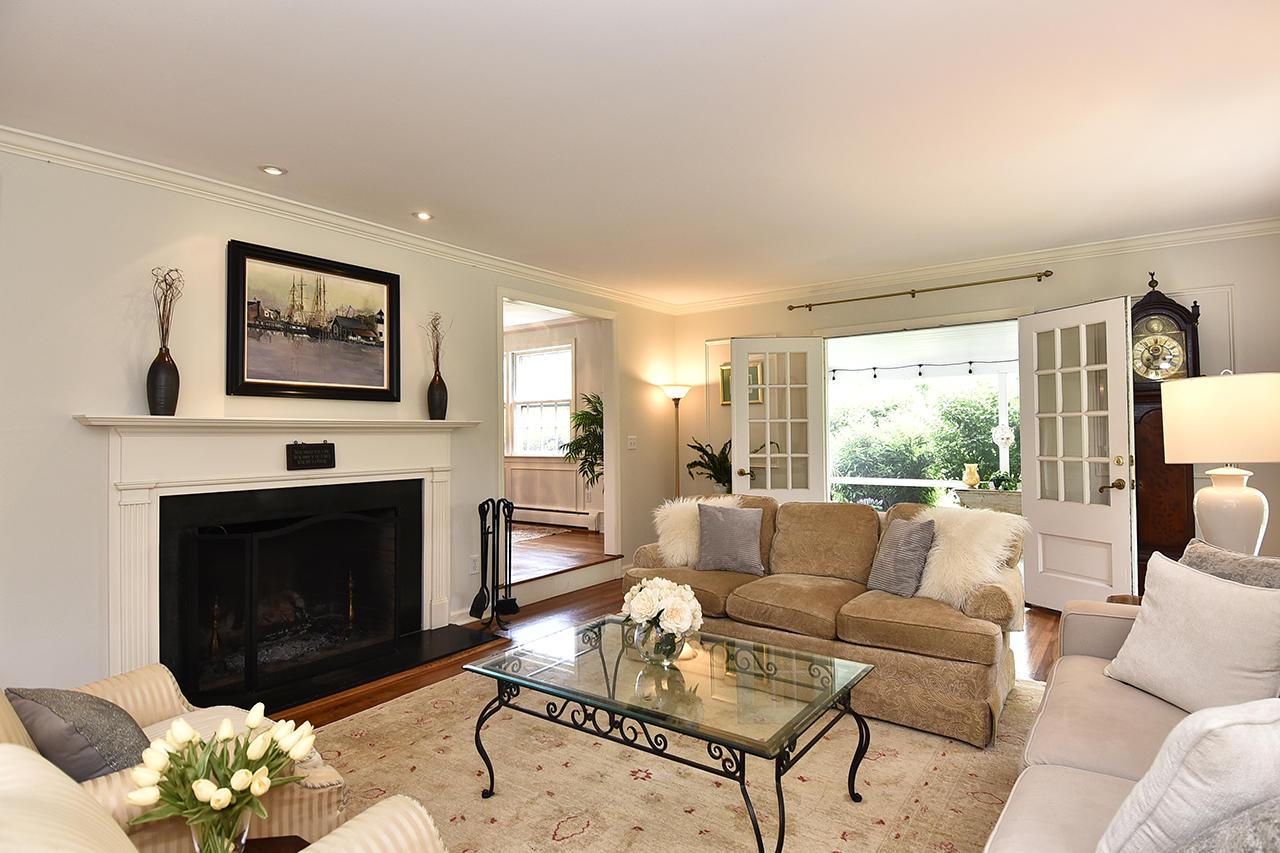 22 Country Club Road New Canaan, CT 06840 - Photo 4 of 47 a living room with furniture couches and a fireplace