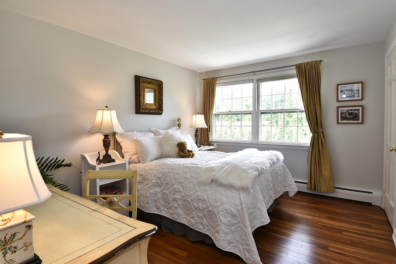 22 Country Club Road New Canaan, CT 06840 - Photo 32 of 47 a bed room with a bed and a window