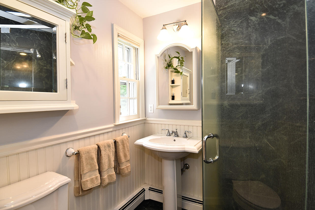 22 Country Club Road New Canaan, CT 06840 - Photo 33 of 47 a bathroom with a sink mirror and toilet