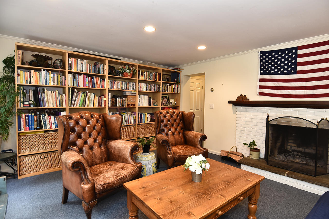 22 Country Club Road New Canaan, CT 06840 - Photo 38 of 47 a living room with furniture and a fireplace
