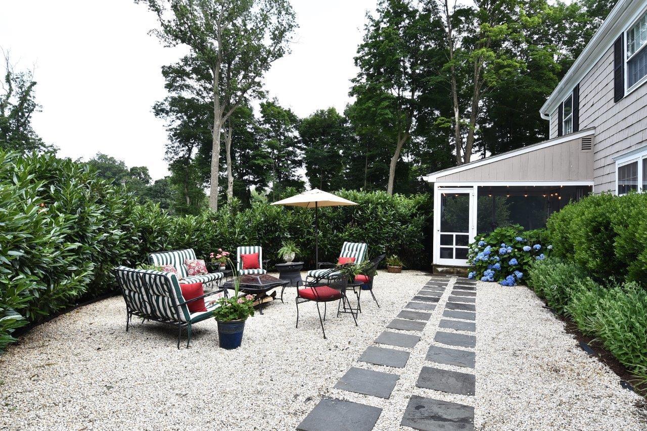 22 Country Club Road New Canaan, CT 06840 - Photo 39 of 47 a view of a patio with chairs and potted plants