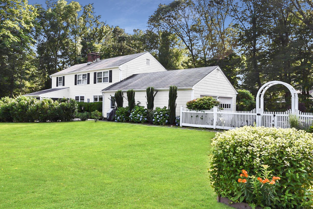 22 Country Club Road New Canaan, CT 06840 - Photo 42 of 47 a front view of a house with garden