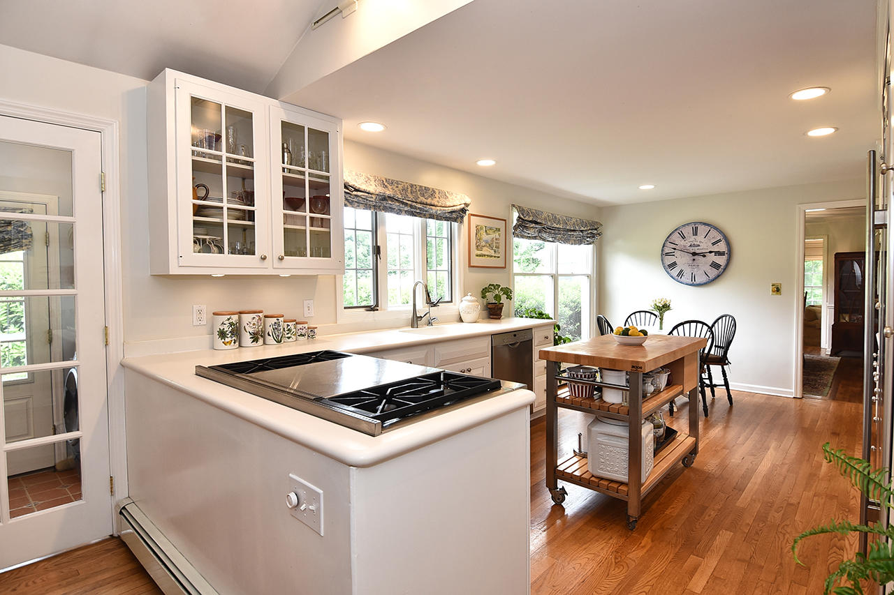 22 Country Club Road New Canaan, CT 06840 - Photo 10 of 47 a kitchen with stainless steel appliances granite countertop a stove and a refrigerator